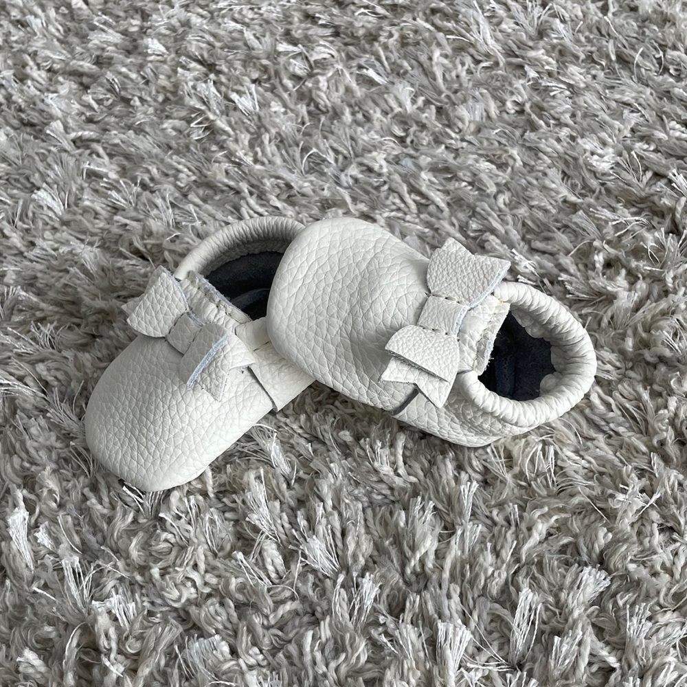 Brand new Freshly Picked white moccasins with bow